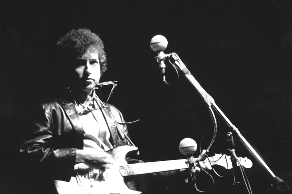Bob Dylan performing at Newport  Folk Festival with his electric guitar