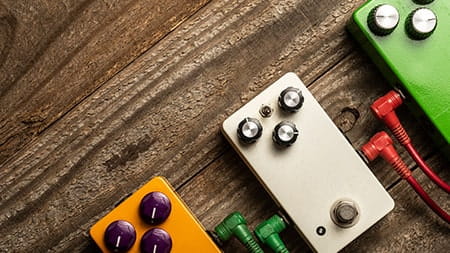 3 guitar pedals on the floor