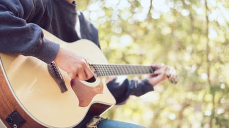 Man playing acoustic guitar