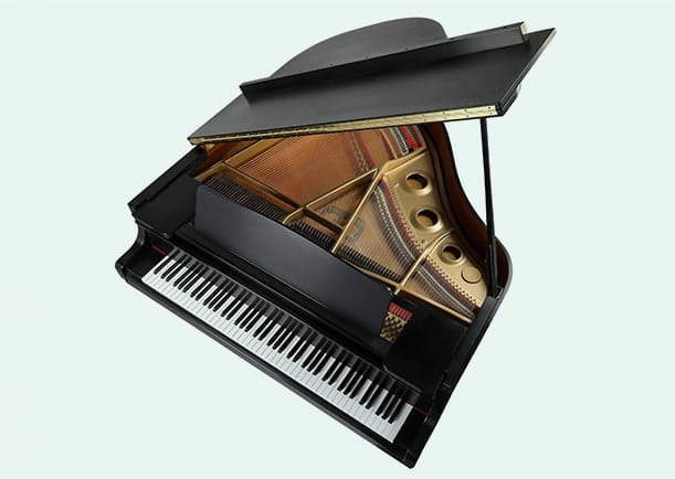 Overhead view of black grand piano on isolated background